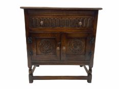Reproduction carved oak cupboard