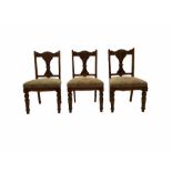 Three Edwardian oak chairs