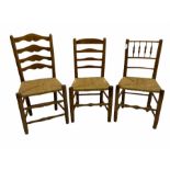 Two 19th century elm ladder back chairs and a 19th century elm spindle back chair