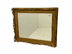 Victorian style rectangular wall mirror in gilt swept frame