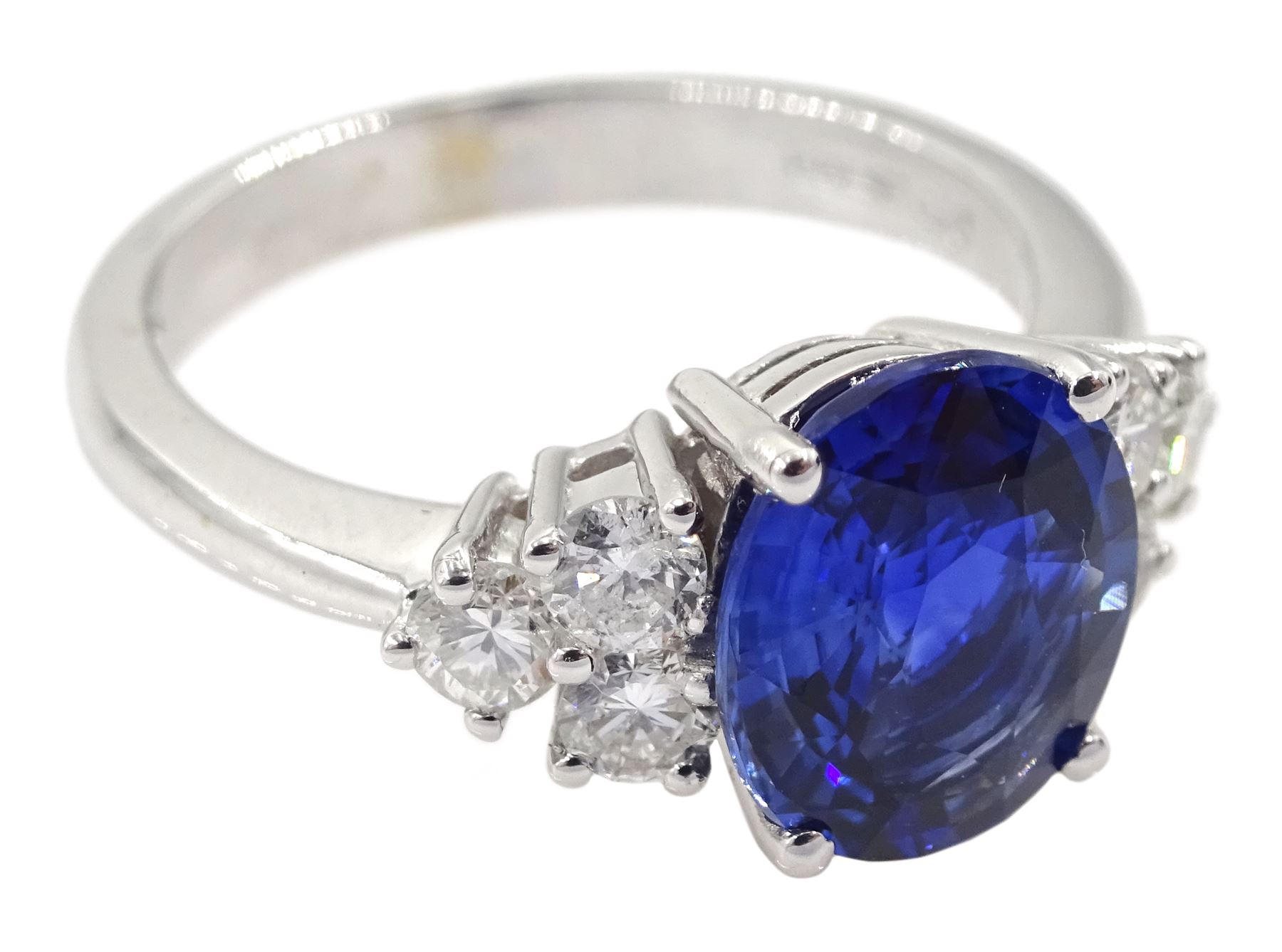 18ct white gold fine oval Ceylon sapphire and six round brilliant cut diamond ring