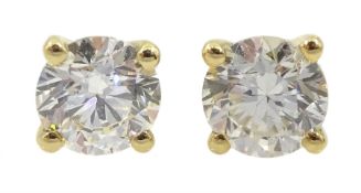 Pair of single stone round brilliant cut diamond stud earrings