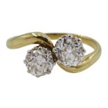 Early 20th century 18ct gold and platinum two stone old cut diamond crossover ring