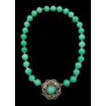 Chinese jade bead necklace with silver open work clasp with a cabochon greenstone/possibly jade bead