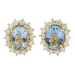 Pair of 18ct gold oval aquamarine and diamond cluster stud earrings