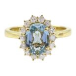 18ct gold oval aquamarine and diamond cluster ring