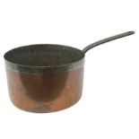 19th century large and heavy seamed copper saucepan with fixed iron handle