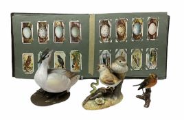 Three ceramic bird figures comprising Royal Crown Derby thrush chicks