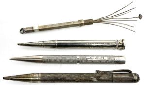 Three silver propelling pencils