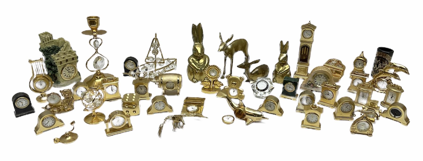 Collection of brass miniature clocks to include examples modelled as mantel clocks