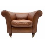 Armchair upholstered in tan leather
