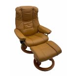 Stressless reclining armchair with matching stool