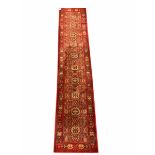 Persian design red ground runner rug