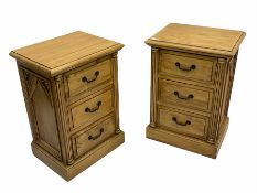 Pair of polished pine three drawer bedside chests