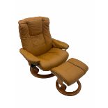 Stressless reclining armchair with matching stool