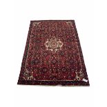 Persian red ground rug