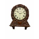 A mid-19th century eight-day Oak cased twin Fusee wall clock with integral support bracket