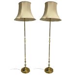 Pair of brass standard lamps with shades