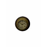20th century brass cased bulkhead clock mounted on a circular mahogany base