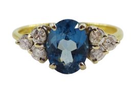 18ct gold oval blue topaz and six stone diamond ring