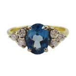 18ct gold oval blue topaz and six stone diamond ring