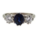 White gold three stone oval sapphire and round brilliant cut diamond ring