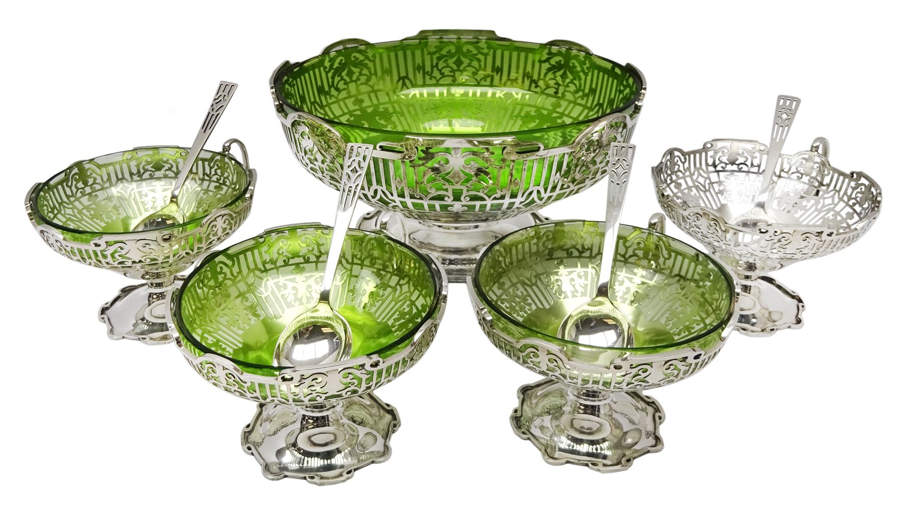 Silver open fretwork dessert service comprising of a pedestal with green glass liner and four matchi
