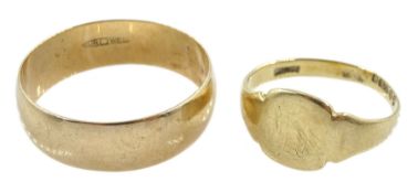 Gold wedding band and a gold signet ring