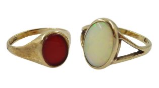 Gold single stone opal ring and a gold single stone carnelian ring