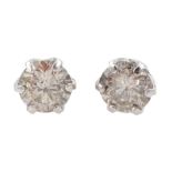 Pair of platinum round brilliant cut diamond stud earrings