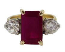 18ct gold three stone emerald cut ruby and round brilliant cut diamond ring