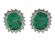 Pair of 18ct white gold cushion cut emerald and round brilliant cut diamond stud earrings
