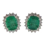 Pair of 18ct white gold cushion cut emerald and round brilliant cut diamond stud earrings
