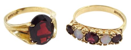 Gold opal and garnet ring ring and a gold single garnet ring