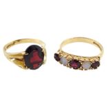 Gold opal and garnet ring ring and a gold single garnet ring