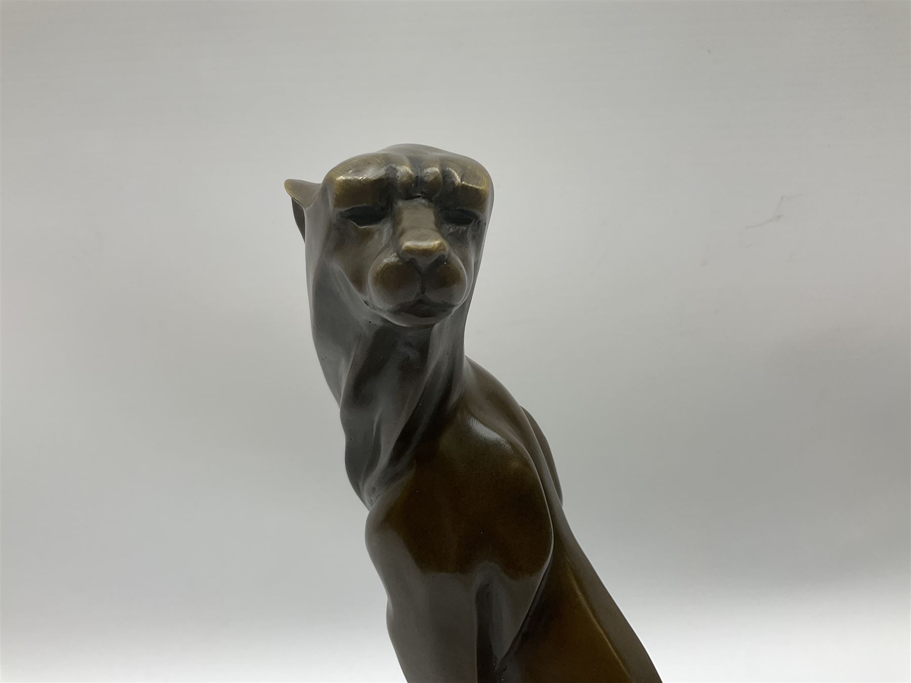 Stylised bronze figure of a seated cheetah after 'Milo' with foundry mark on circular base - Image 3 of 8