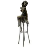 Art Deco style bronze modelled as a bare chested female figure seated upon a chair