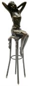 Art Deco style bronze modelled as a female figure seated upon a chair