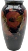Moorcroft vase of shouldered ovoid form decorated in the 'Pomegranate' pattern upon dark blue ground