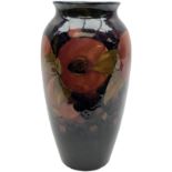 Moorcroft vase of shouldered ovoid form decorated in the 'Pomegranate' pattern upon dark blue ground