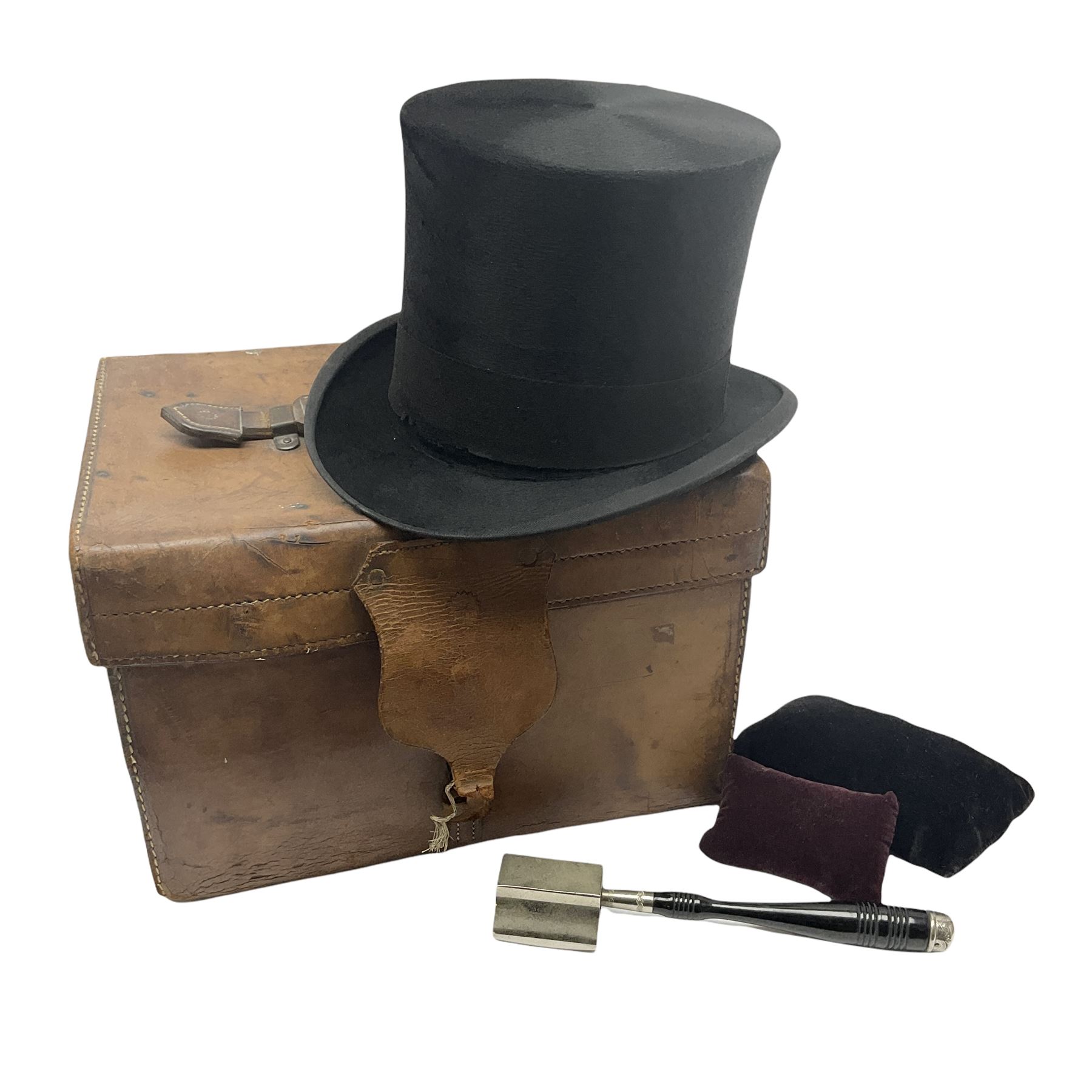 Gentlemen's black brushed silk top hat by Henry Heath of London housed in a leather case with dark r