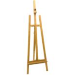 large wooden easel with adjustable picture rest