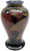 Moorcroft vase of baluster form decorated in the 'Pomegranate' pattern upon dark blue ground with im