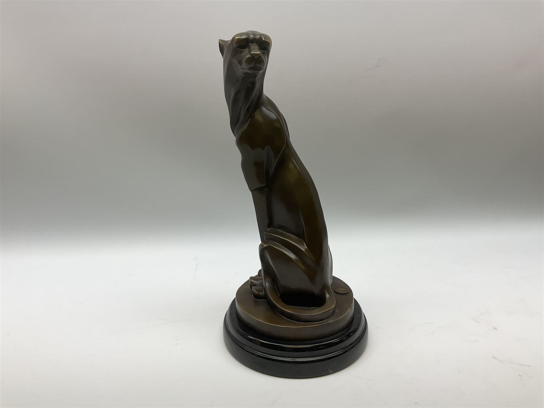 Stylised bronze figure of a seated cheetah after 'Milo' with foundry mark on circular base - Image 2 of 8