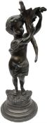 Bronzed putti figure holder a floral trumpet