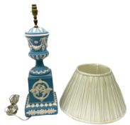 Ceramic urn shaped table lamp on a square pedestal base