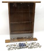 Collection of souvenir teaspoons with wooden display case