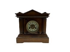 A light mahogany eight-day striking German mantle clock manufactured in the late 19th century by the