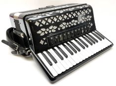 Italian E. Soprani piano accordion in black and silver case