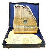 Supertone stringed accordion by Abbley & Son London with simulated oak finish and transferred keyboa